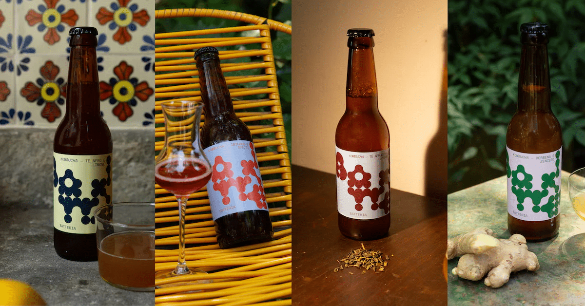 Four bottles of Batteria kombucha in assorted flavors with a glass and fresh ginger, served at Sfoglia Re